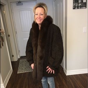 Persian lamb coat with fox tuxedo collar.